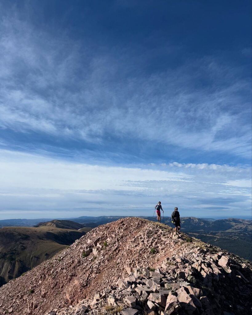 trail runners on a mountaintop at the Wyoming Range 100 in the Bighorn Mountains of Wyoming