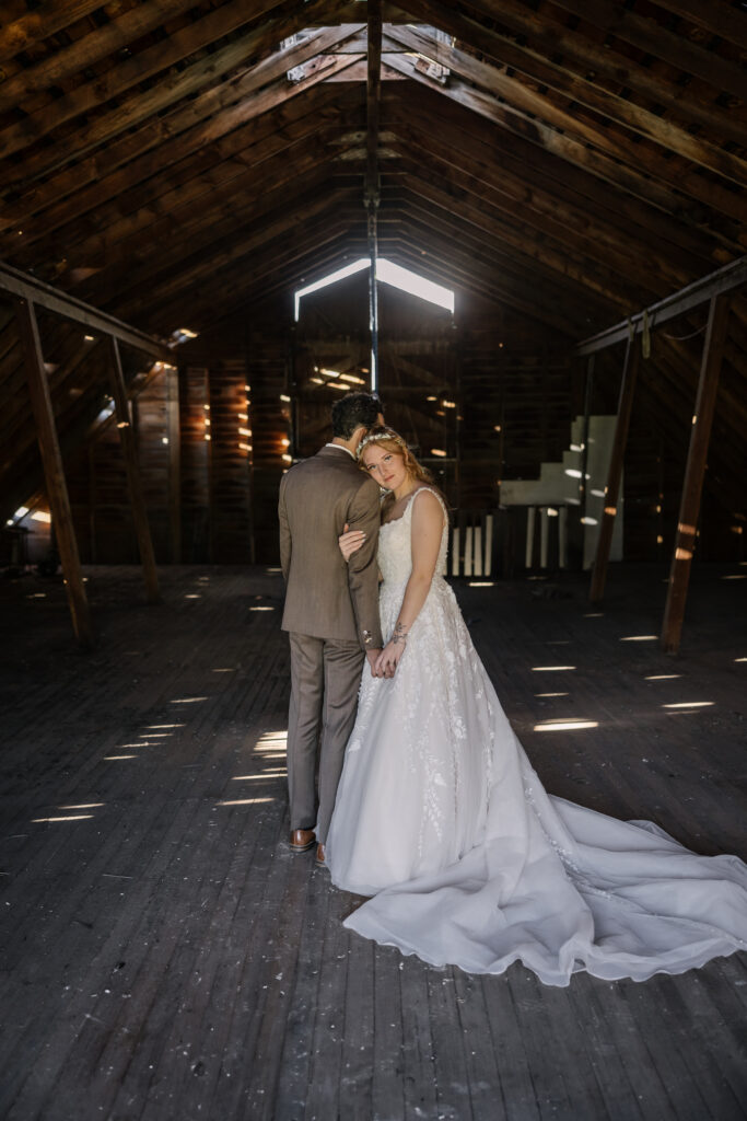 intimate wedding portraits in a barn in Wyoming
